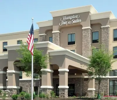 a building with an american flag in front of it at Hampton Inn & Suites Philadelphia Montgomeryville in North Wales