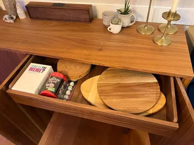 a wooden shelf with plates and other items on it at The Outpost Camelback Walk to Ski, Swim, and Fun! in Tannersville