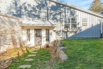 a white house with a fire hydrant in front of it at Underground Railroad Barn in Kennett Square