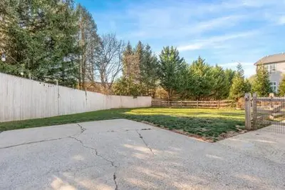 a driveway in a yard with a fence and a yard at Underground Railroad Barn in Kennett Square