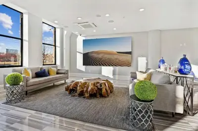 a living room with a couch and a table at XL Studio - Premier Studio with Gym Access in Philadelphia