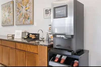 a kitchen with a stove and a counter top at XL Studio - Stylish Studio with Rooftop Pool in Philadelphia
