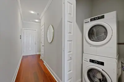 a laundry room with a washer and dryer in it at XL Studio - Luxury Studio Near Center City in Philadelphia