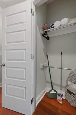 a closet with a white door and a mop at XL Studio - Luxury Studio Near Center City in Philadelphia
