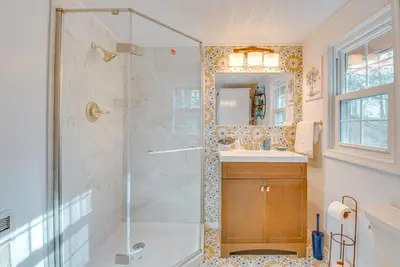 a bathroom with a shower with a glass door at Arrowhead Lake Access Cabin with Resort Amenities in Pocono Lake