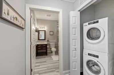 a laundry room with a washer and dryer in it at XL Studio - Chic Flat - Rooftop Pool & Gym in Philadelphia