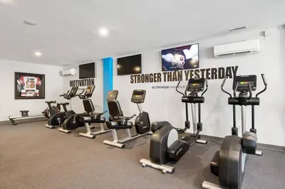 a gym with a bunch of exercise equipment in it at XL Studio - Chic Flat - Rooftop Pool & Gym in Philadelphia