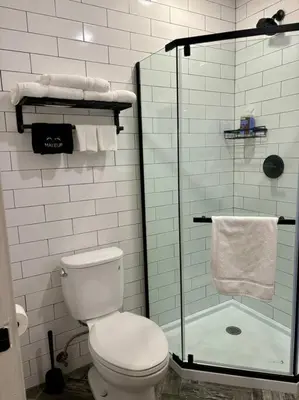 a bathroom with a toilet and a glass shower at Veau3 1BD 1BA minutes to NYC in Newark