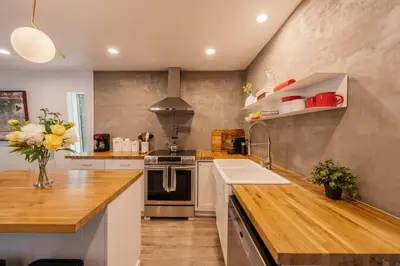 a kitchen with a sink and a counter top at Modern chalet for 8 people with Fireplace, Hot Tub and nearby Skiing in Tobyhanna