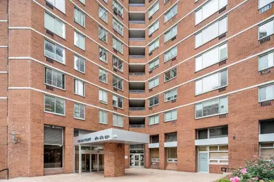 a large brick building with a sign in front of it at Kips Bay 1br w doorman wd gym nr hospital NYC-1402 in New York