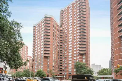 a tall red brick building in a city at Kips Bay 1br w doorman wd gym nr hospital NYC-1402 in New York