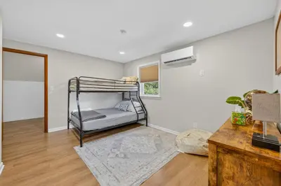 a bedroom with a bunk bed in a room at The Edamame House in Nazareth