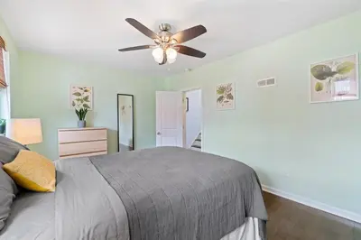 a bedroom with a bed and a ceiling fan at Double Decker Roofdeck Gorgeous View in Passyunk in Philadelphia