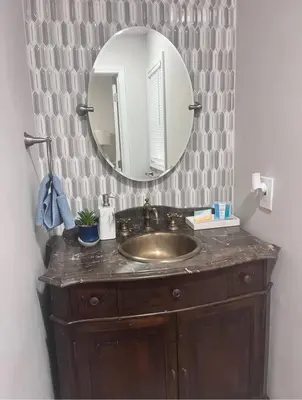 a bathroom with a sink and a mirror at Peaceful place at the lake in Susquehanna