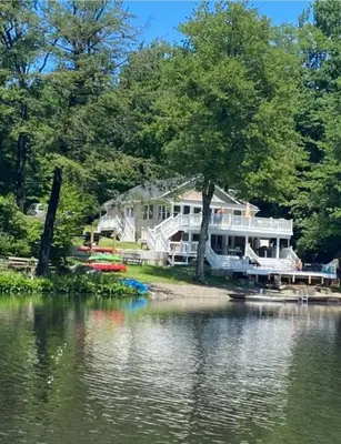 a large house on the shore of a body of water at Peaceful place at the lake in Susquehanna
