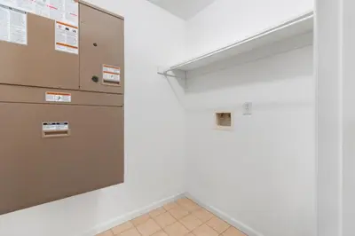 an empty room with a door and a wall at UrbanNest XL in Bayonne