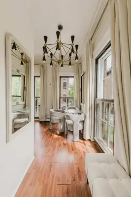 a living room with a couch and a table at The West Village Gem in New York