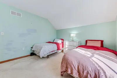 a bedroom with two beds in a attic at 11 Mi to Camelback Resort Tobyhanna Home! in Tobyhanna