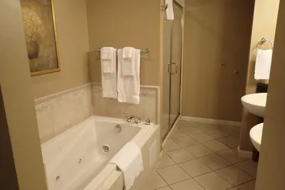 a bathroom with a bath tub and a sink at Pine Barn Inn in Danville