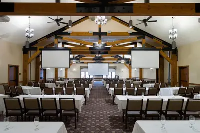 an empty banquet hall with tables and chairs at Pine Barn Inn in Danville