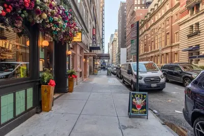 a city street with cars parked on the street at Midtown West 1br w doorman nr rockefeller center NYC-1394 in New York