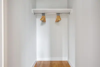 an empty room with white walls and curtains at Midtown 1br w gym elevator nr Rockefeller Ctr NYC-1401 in New York