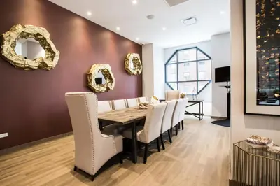 a dining room with a table and chairs at Midtown 1br w gym elevator nr Rockefeller Ctr NYC-1401 in New York