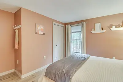 a bedroom with a bed and a window at Peaceful Pocono Gem! Cabin 6 Mi to Dtwn Jim Thorpe in Jim Thorpe