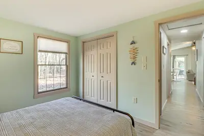 a bedroom with a bed and a window at Peaceful Pocono Gem! Cabin 6 Mi to Dtwn Jim Thorpe in Jim Thorpe