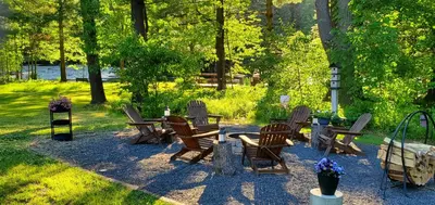 a group of chairs and tables in a park at Paper Mill Pines Bed and Breakfast in Shickshinny
