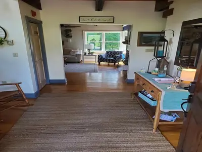 a living room with a couch and a table at Paper Mill Pines Bed and Breakfast in Shickshinny