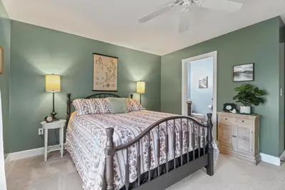 a bedroom with a bed and green walls at Paper Mill Pines Bed and Breakfast in Shickshinny