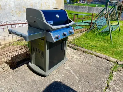 a grill sitting on top of a stove at Bright, Stylish & Cozy 2Bed Unit w/Backyard & Grill Close to NYC! in Haledon