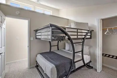 a bedroom with a bunk bed in a room at Creekside Recess Hottub Sauna Firepit Gameroom