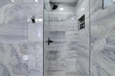 a bathroom with a shower with a glass door at POCONOS BRAND NEW LAKEFRONT Oasis 1 ACRE, HOTTUB GAMEROOM FIREPITS TALK ABOUT PRIVACY in Albrightsville