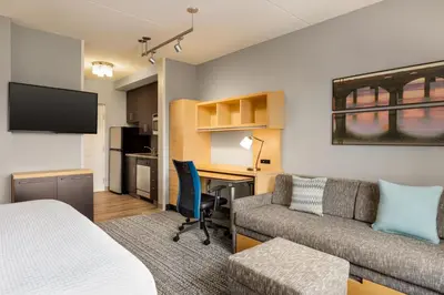 a hotel room with a bed and a desk and a couch at TownePlace Suites by Marriott Harrisburg West/Mechanicsburg in Mechanicsburg