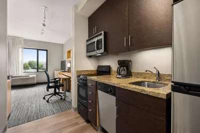 a kitchen with a sink and a microwave at TownePlace Suites by Marriott Harrisburg West/Mechanicsburg in Mechanicsburg