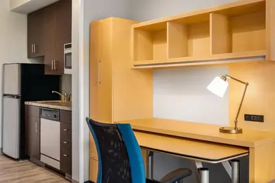 a desk with a lamp and a chair in a kitchen at TownePlace Suites by Marriott Harrisburg West/Mechanicsburg in Mechanicsburg