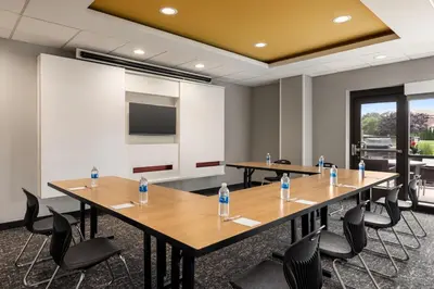 a meeting room with tables and chairs with water bottles on them at TownePlace Suites by Marriott Harrisburg West/Mechanicsburg in Mechanicsburg