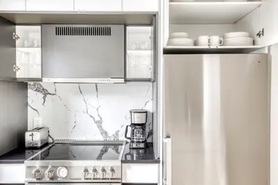 a kitchen with a coffee maker in a refrigerator at BK Heights 2BR w WD Elevator nr Promenade NYC-910 in Brooklyn