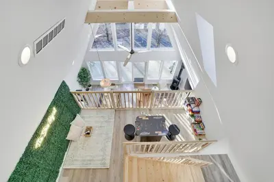 an overhead view of the living room of a house at Modern A-frame in woods with Sauna, HotTub, Privacy in Albrightsville