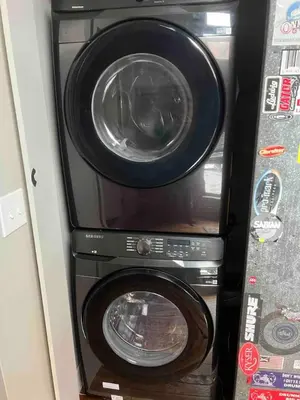 two washing machines and a dryer in a vehicle at Sweet Lancaster Apt. A in Lancaster