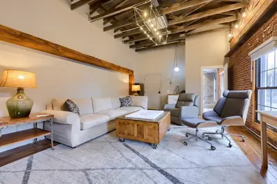 a living room with a couch and two chairs at Sweet Lancaster Suite in Lancaster
