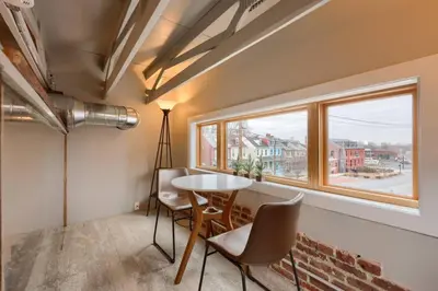 a room with a table and chairs and a window at Sweet Lancaster Suite in Lancaster