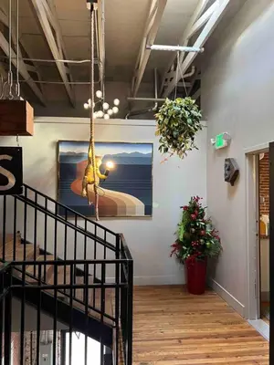 a room with a staircase and a painting on the wall at Sweet Lancaster Suite in Lancaster