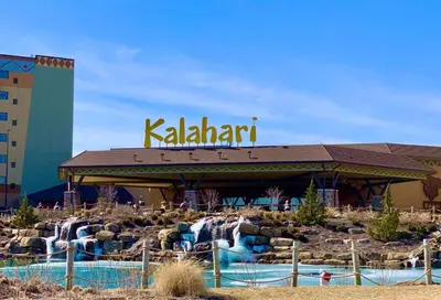 a restaurant with a water park in front of a building at Poconos Chalet in Tobyhanna