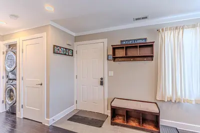 a laundry room with a washer and dryer at Skylift Lodge - Luxury Mountain Creek family condo in Vernon Township