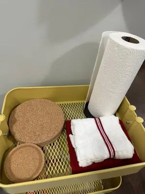 a tray with towels and a roll of toilet paper at Cozy 2 BR suite, 10 min to NYC &Times Sq in West New York