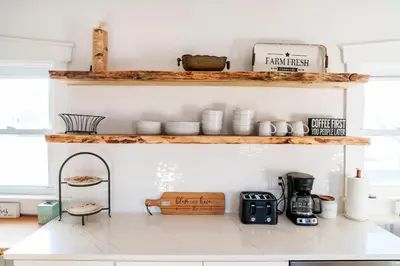 a kitchen with white walls and wooden shelves at Very Cozy, 2 Bedroom Farmhouse Apartment 2nd FL in Lancaster