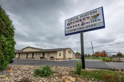 a sign in front of a building with a hotel sign at Lock Haven Grandview Hotel in Mill Hall